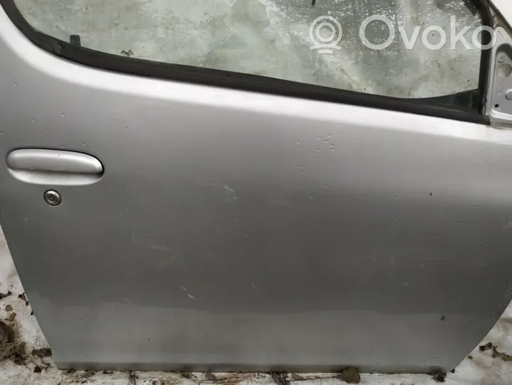 Toyota Yaris Verso Drzwi przednie pilkos