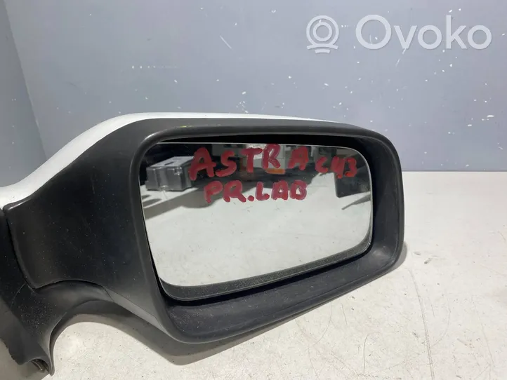 Opel Astra G Specchietto retrovisore manuale E11015720