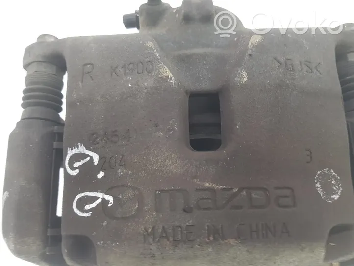 Mazda 3 Zacisk hamulcowy przedni B4Y73398ZB