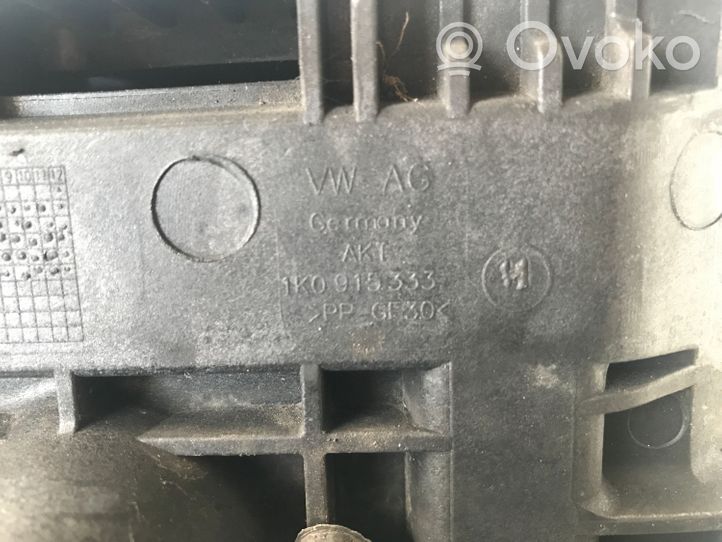 Volkswagen PASSAT B7 Support boîte de batterie 1K0915333