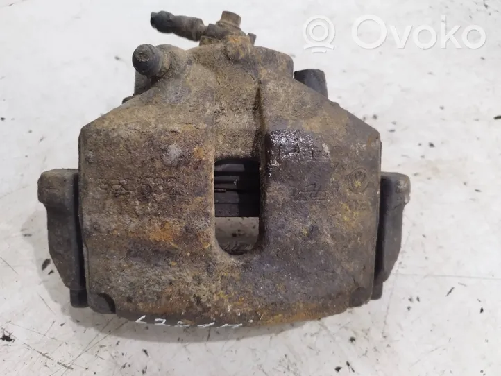 Volkswagen PASSAT B7 Front brake caliper 