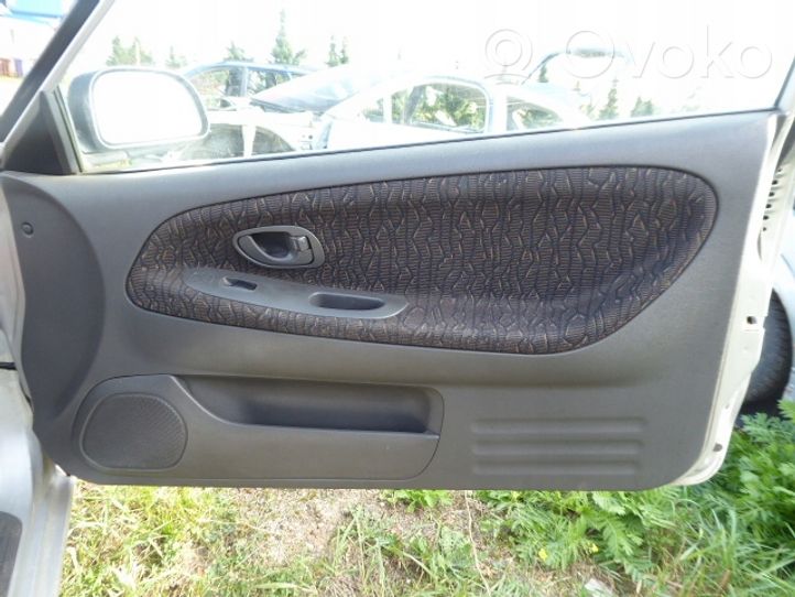 Mitsubishi Colt Front door card panel trim 