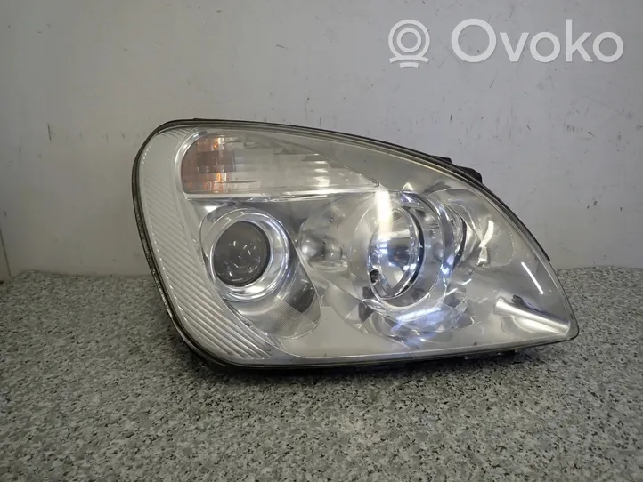 KIA Carens II Lampa przednia 