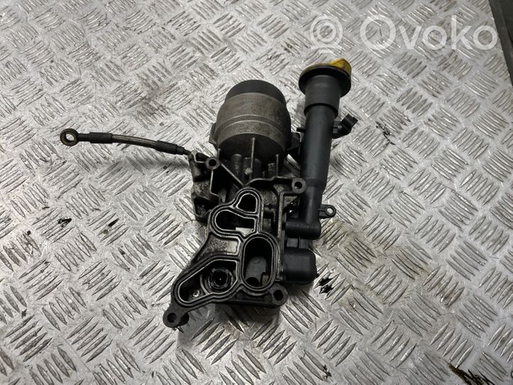 Opel Corsa D Supporto di montaggio del filtro dell’olio 55210824