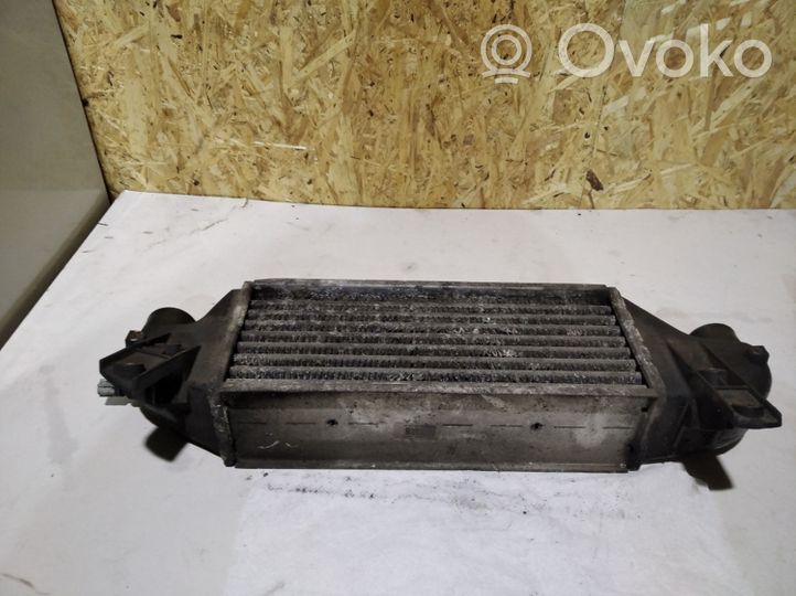 Ford Focus Starpdzesētāja radiators XS4Q9L440BD