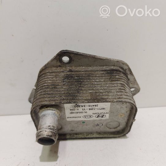 KIA Ceed Engine oil radiator 264102A300