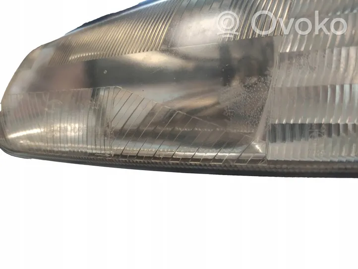 Chrysler Town & Country III Lampa przednia 04897389AC