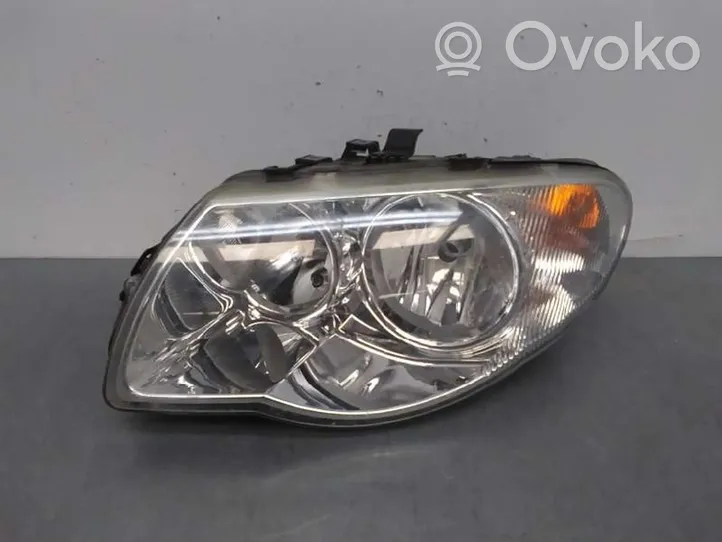 Chrysler Voyager Lampa przednia 04857831AC