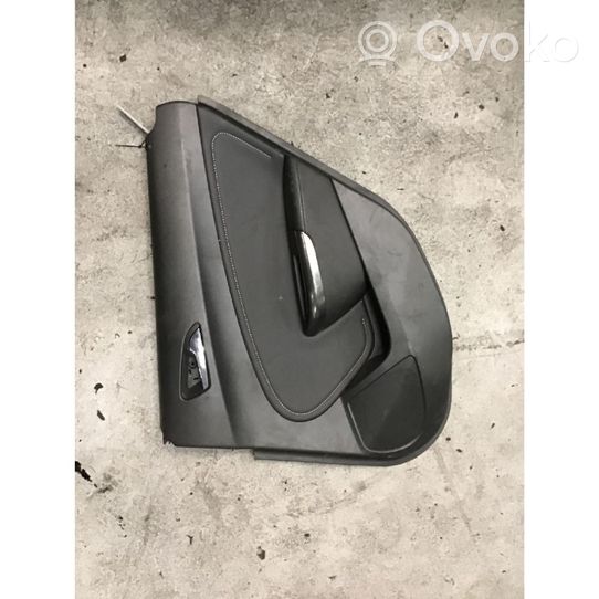 Opel Astra J Rivestimento del pannello della portiera posteriore 