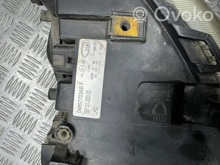 Chrysler Voyager Lampa przednia 04857703AB