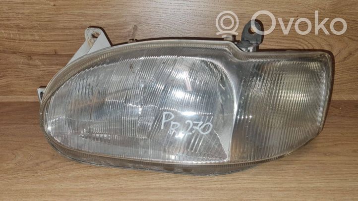 Ford Escort Lampa przednia 95AG13K060BA