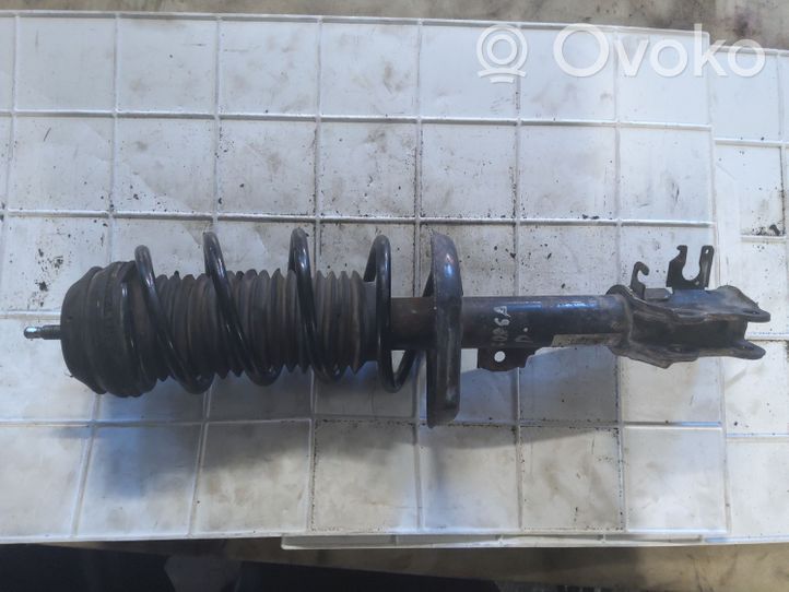 Opel Corsa D Front shock absorber with coil spring 13214354