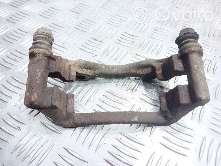 Volkswagen PASSAT B4 Plaquette / support d'étrier avant 