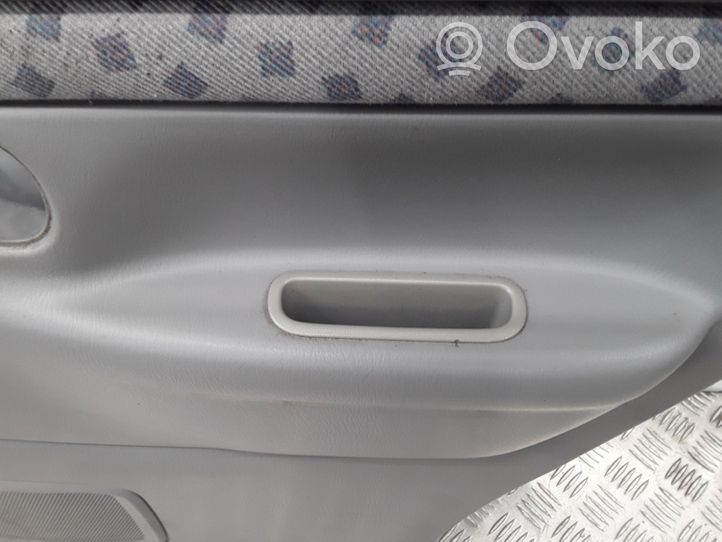 Mazda Demio Garniture panneau de porte arrière D28068520