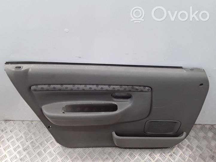 Mazda Demio Garniture de panneau carte de porte avant DC3668450