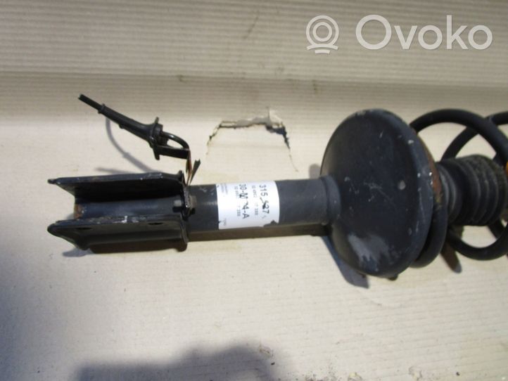 Dacia Logan I Front shock absorber with coil spring 