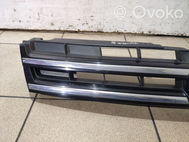 Volkswagen Touareg II Front bumper upper radiator grill 7P6853651A