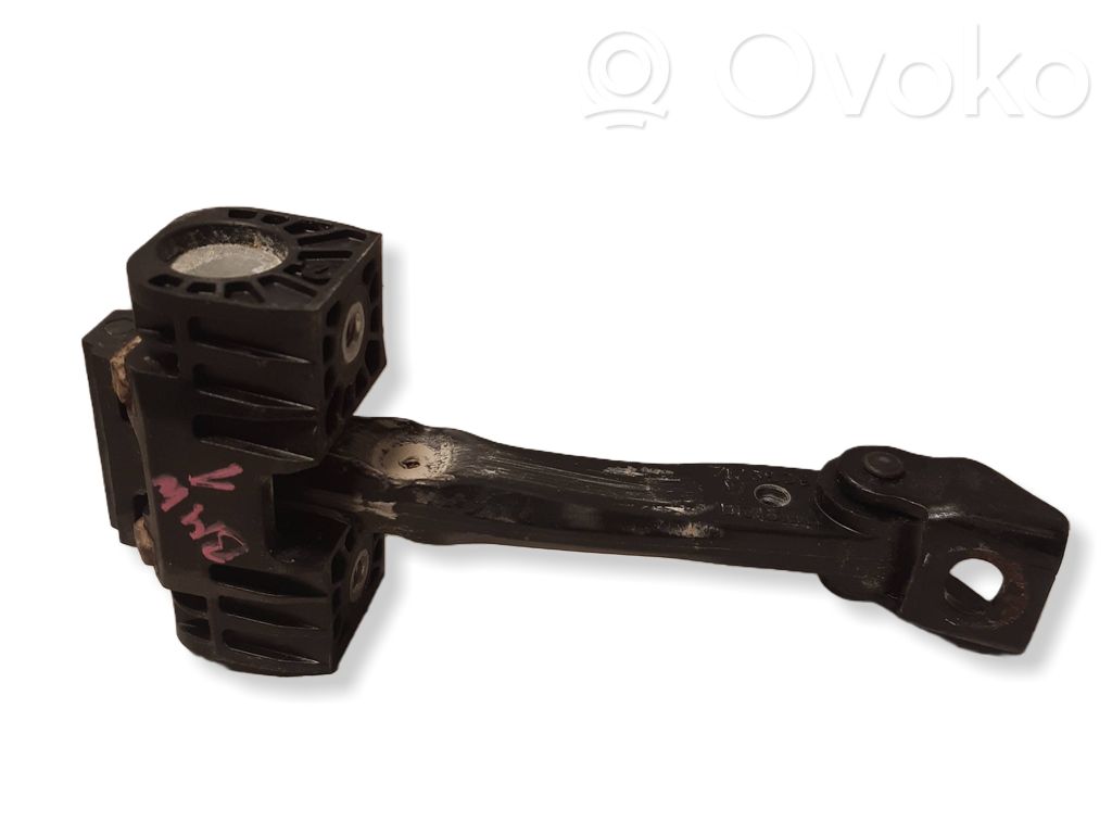 Front door check strap stopper   7176809