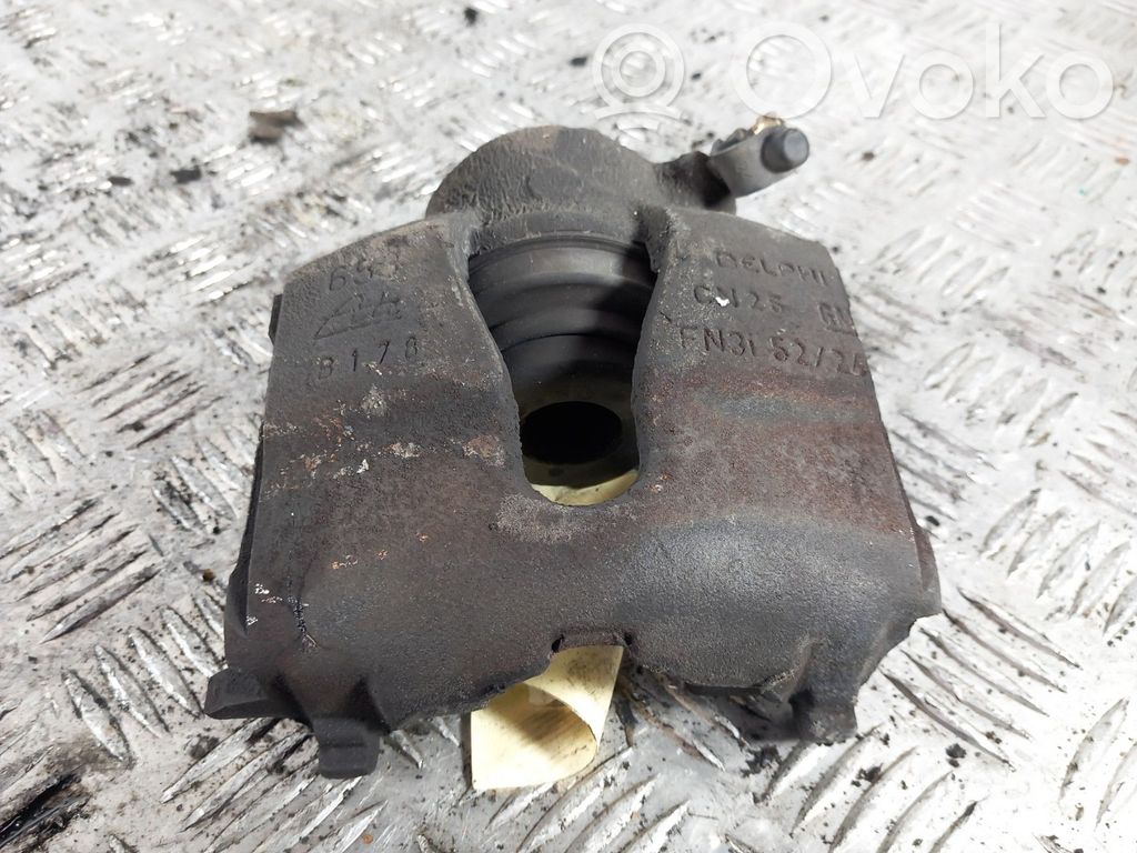 Opel Astra G Zacisk hamulcowy przedni 