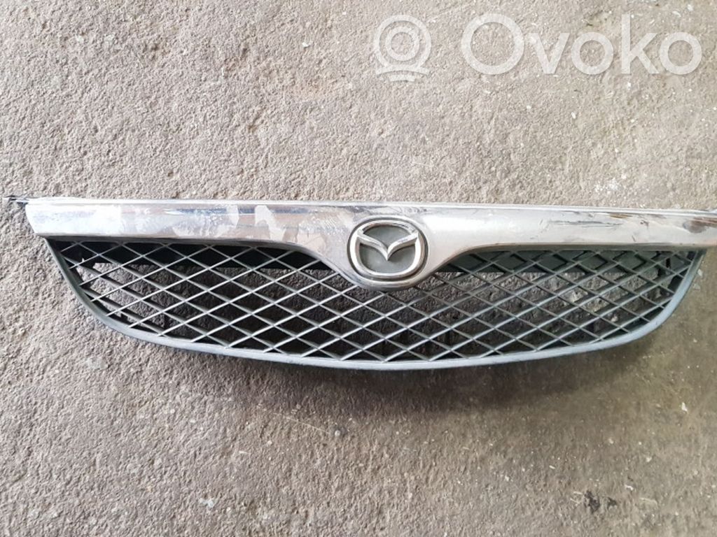 Mazda 626 Front bumper upper radiator grill 