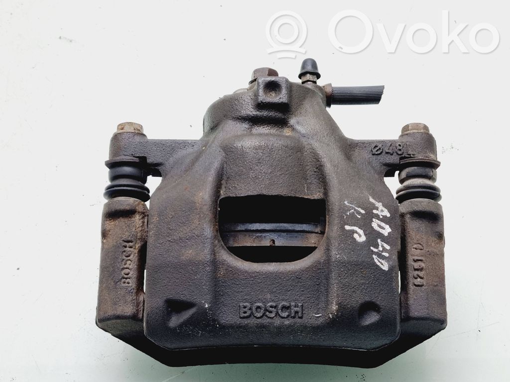 Toyota Aygo AB40 Zacisk hamulcowy przedni 