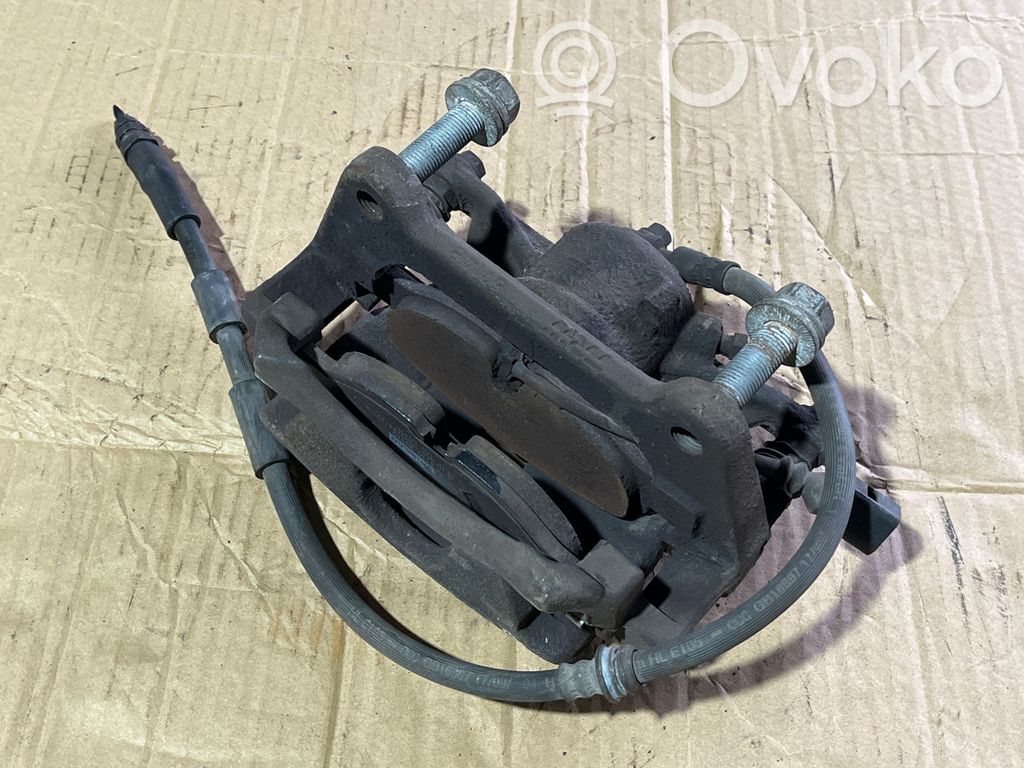 Volkswagen Touran III Zacisk hamulcowy przedni 