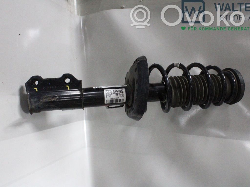 Opel Astra J Amortyzator osi przedniej ze sprężyną 