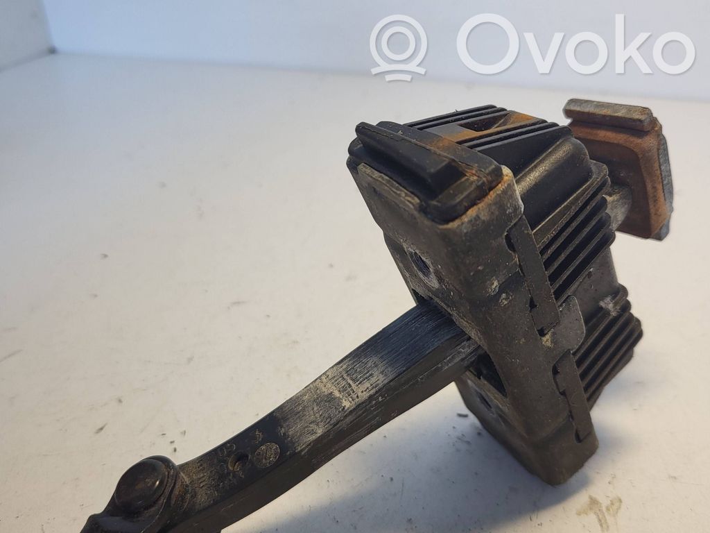 Front door check strap stopper   7176807