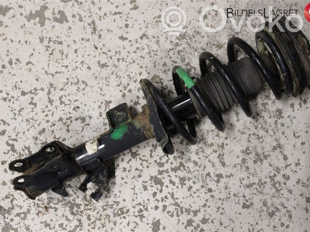 Nissan NV200 Front shock absorber with coil spring 