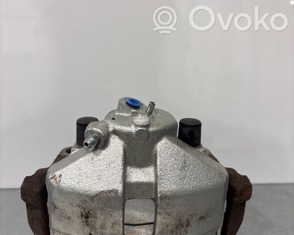 Volkswagen PASSAT B7 Zacisk hamulcowy przedni