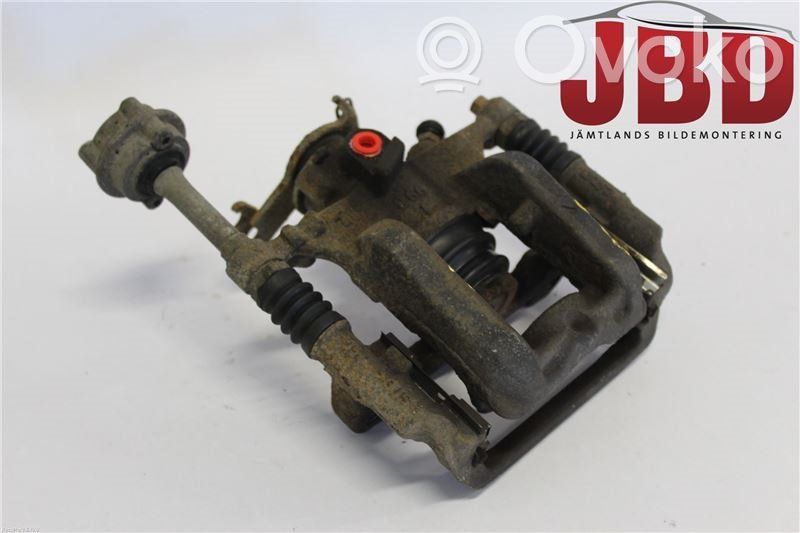 Opel Astra J Tylny zacisk hamulcowy 