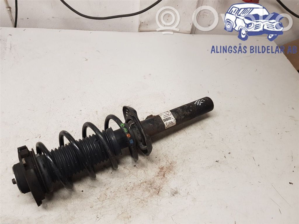 Volkswagen Golf VI Amortyzator osi przedniej ze sprężyną 