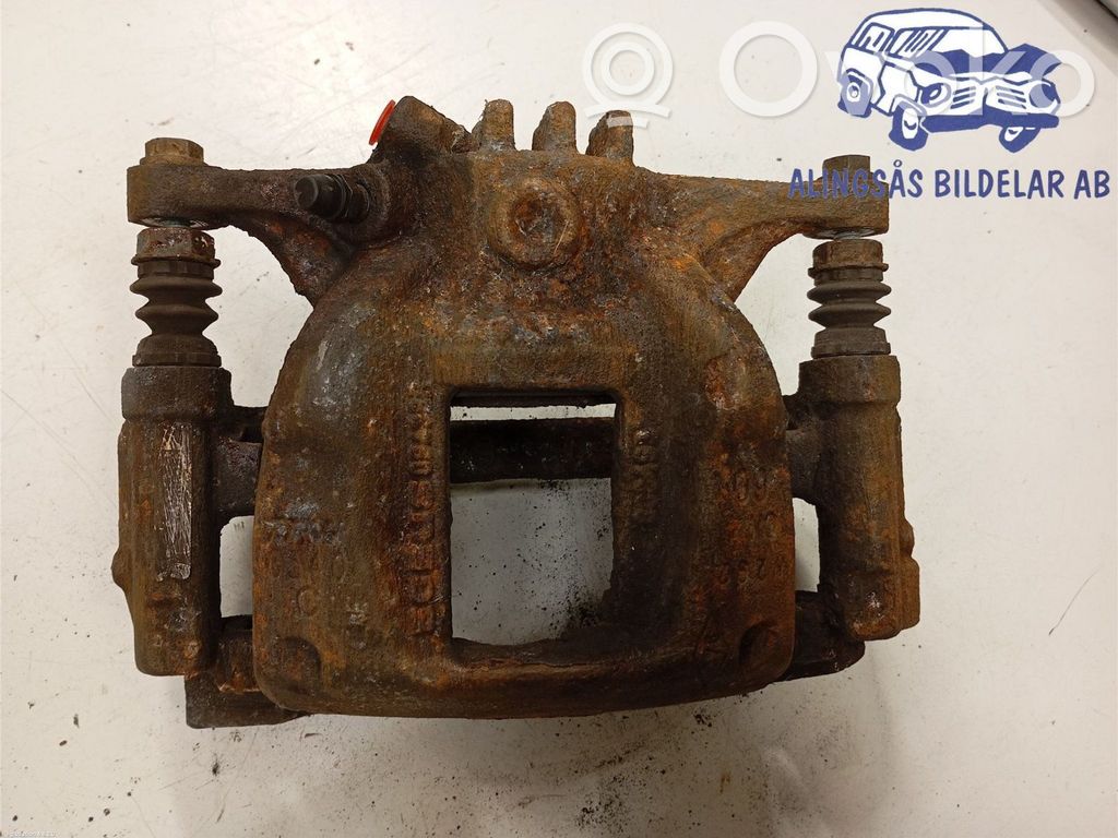 Nissan NV300 Zacisk hamulcowy przedni 