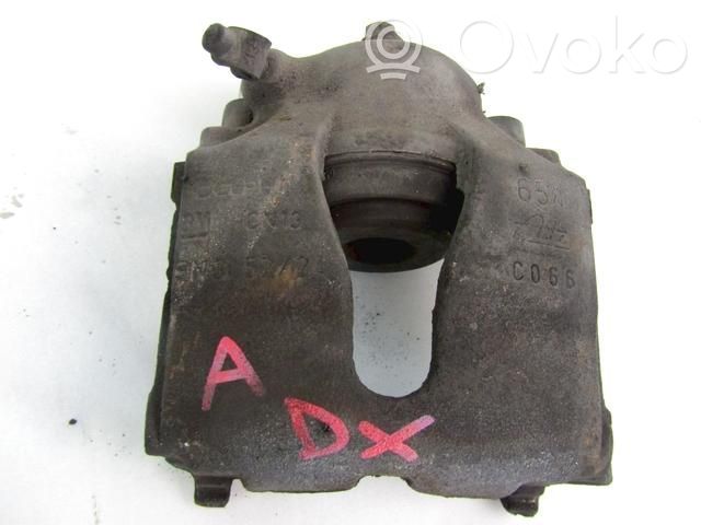Opel Astra G Zacisk hamulcowy przedni 