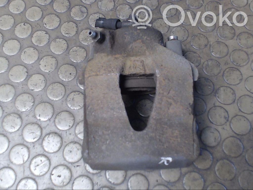 Volkswagen Golf V Zacisk hamulcowy przedni 