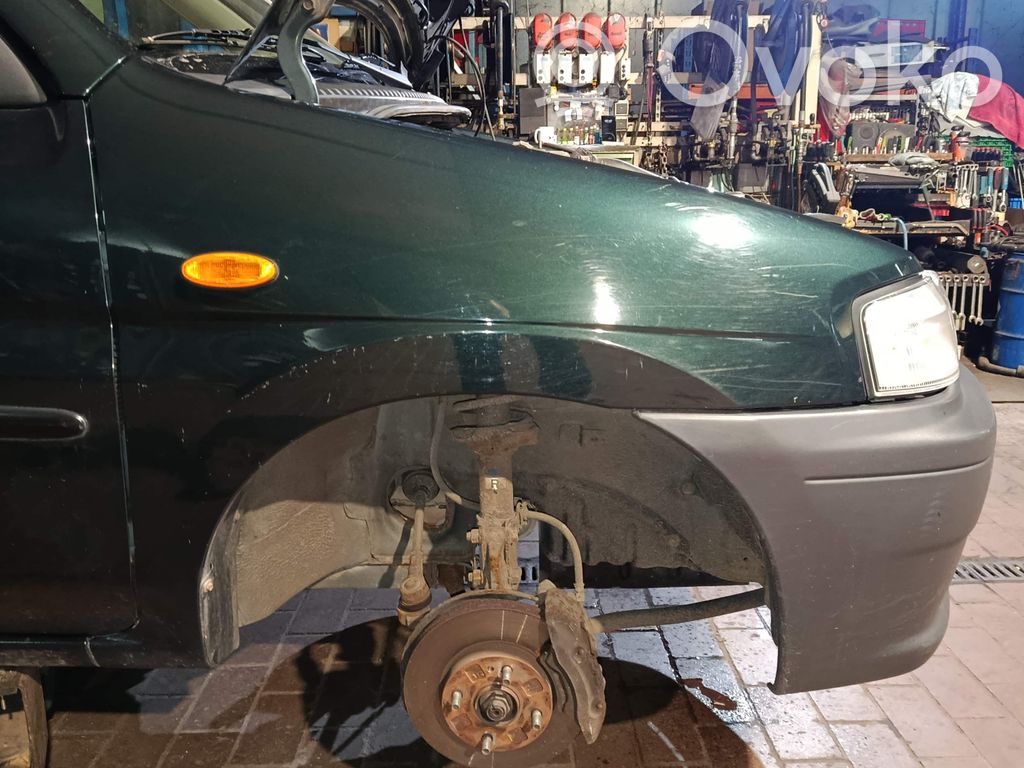 Mazda Demio Błotnik przedni 