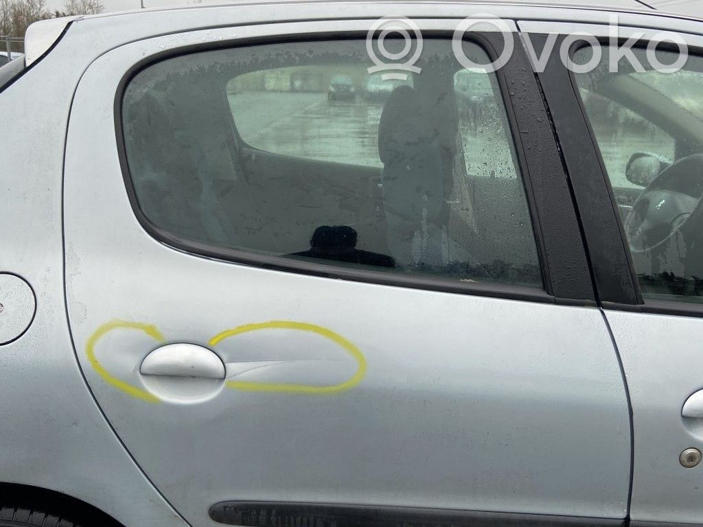 Peugeot 206 Elektryczny podnośnik szyby drzwi tylnych 