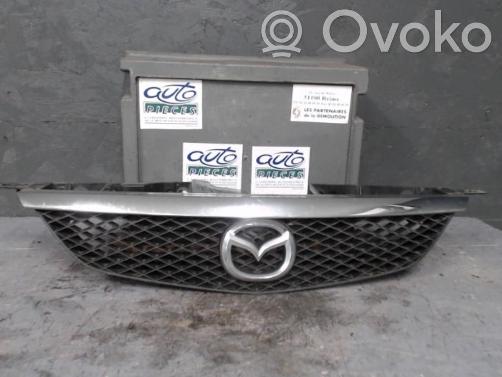 Mazda 323 F Front bumper upper radiator grill 