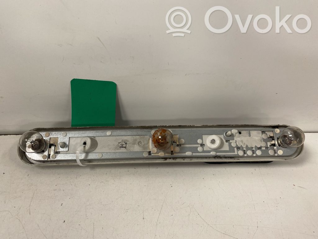 Tail light bulb cover holder