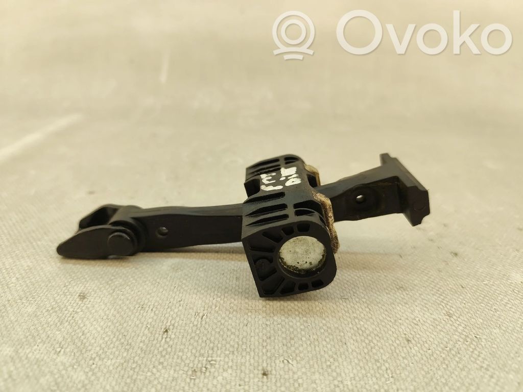 Front door check strap stopper   7176809