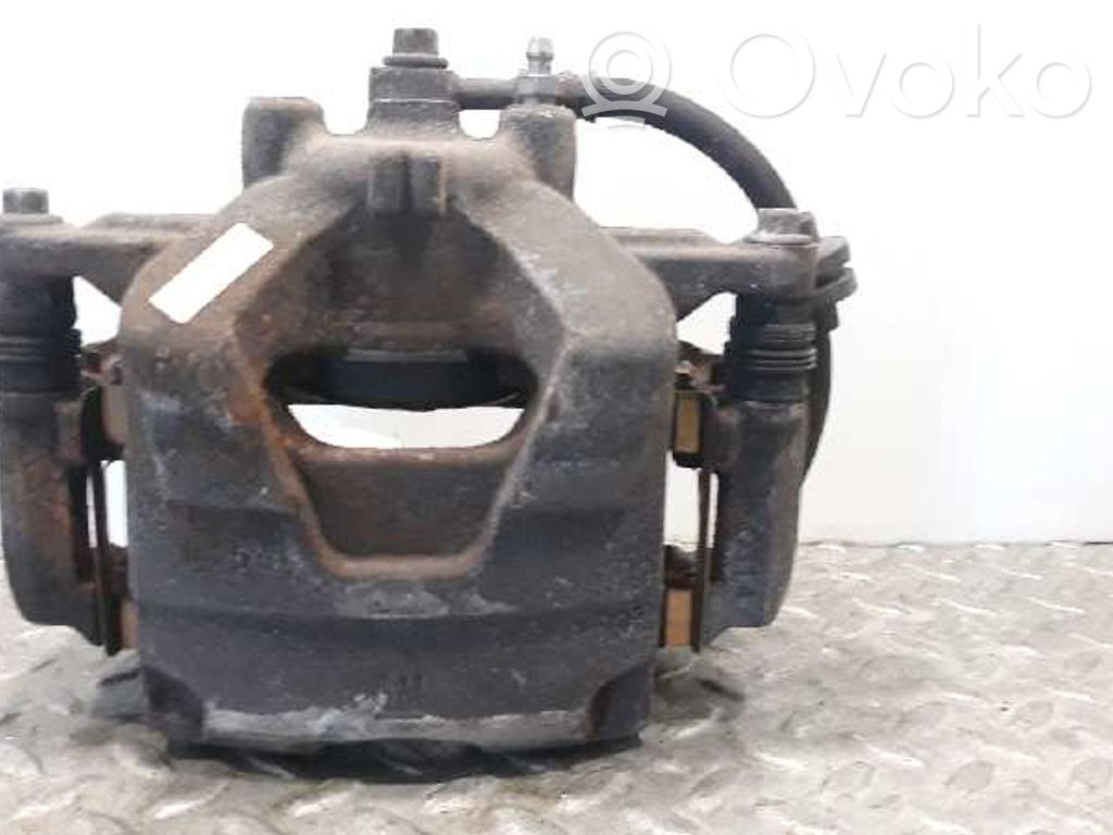 Opel Astra J Zacisk hamulcowy przedni 