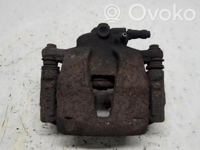 Opel Corsa D Zacisk hamulcowy przedni 