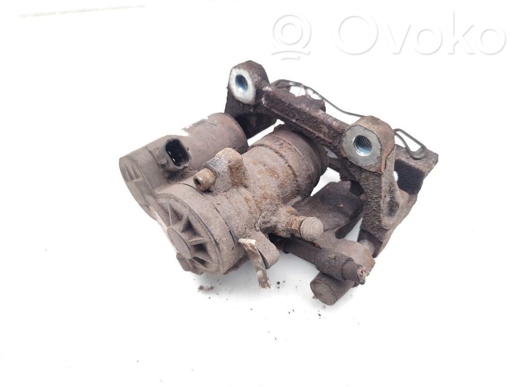 Ford Mondeo MK V Tylny zacisk hamulcowy 
