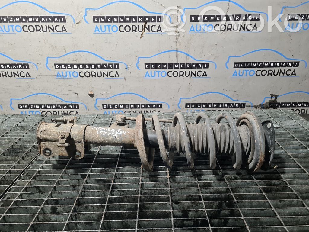 Suzuki Grand Vitara II Front shock absorber with coil spring 