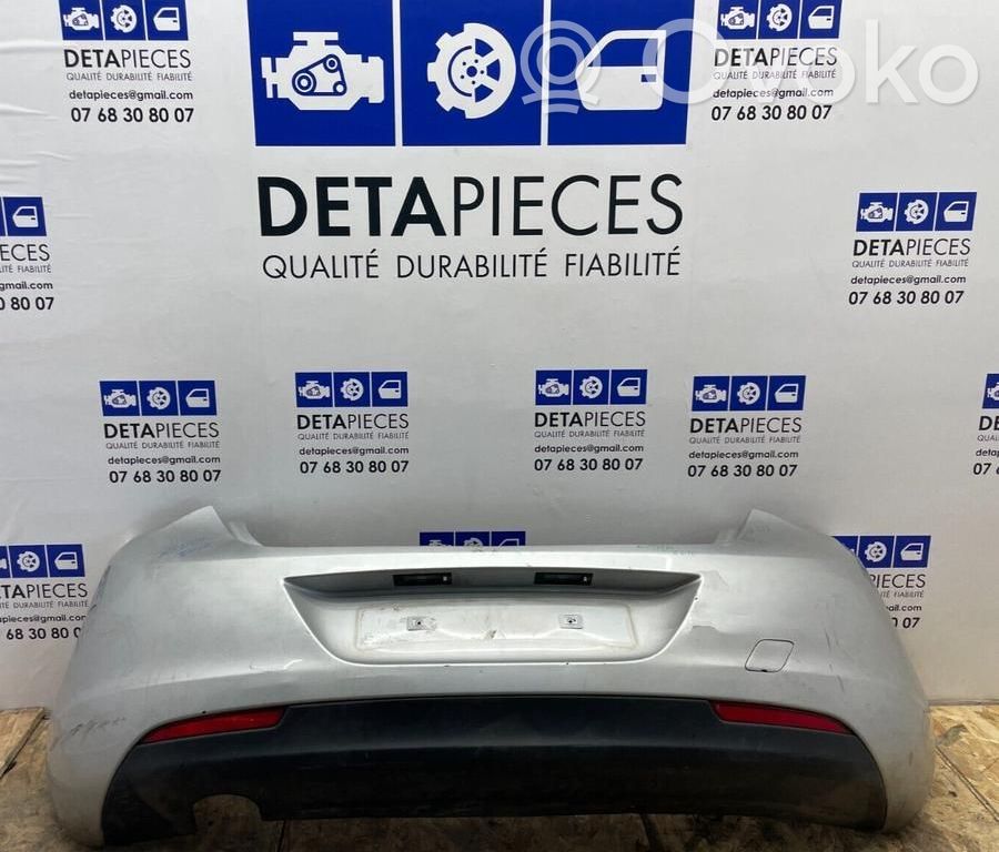 Opel Astra J Бампер 