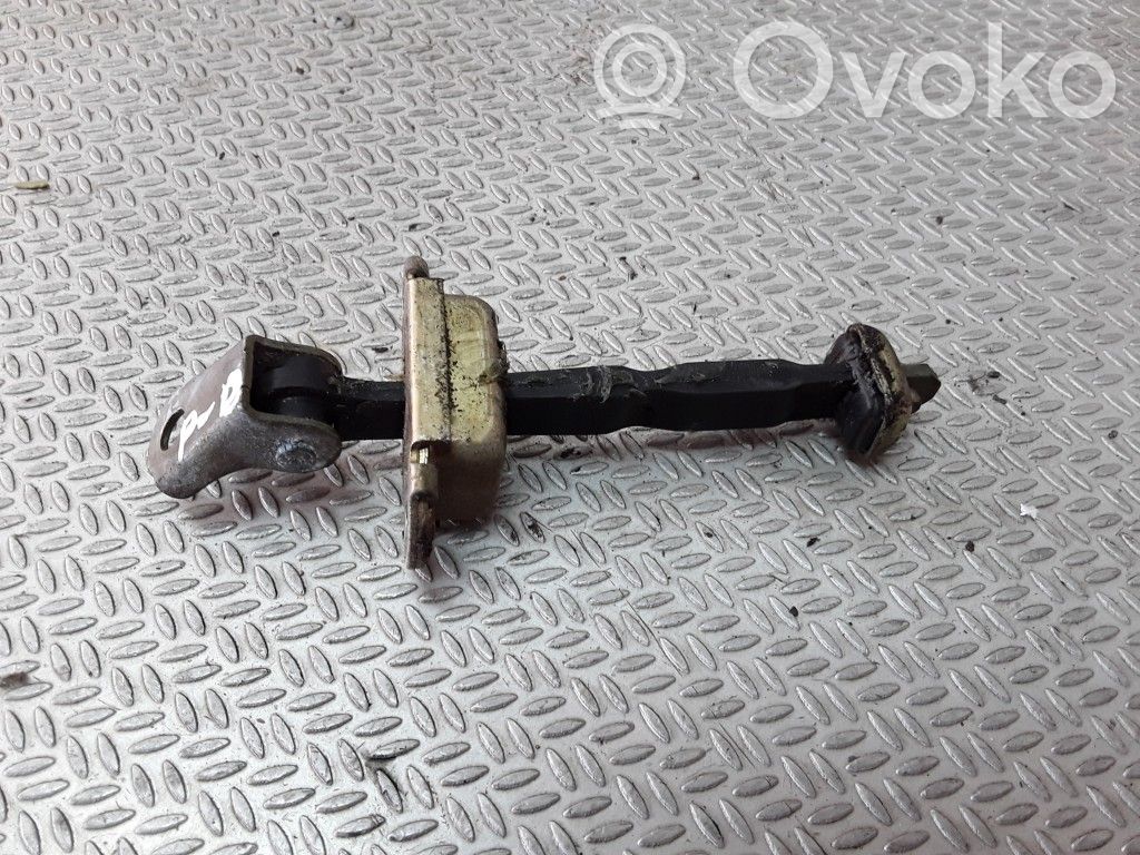 Front door check strap stopper