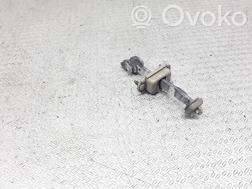 Rear door check strap stopper