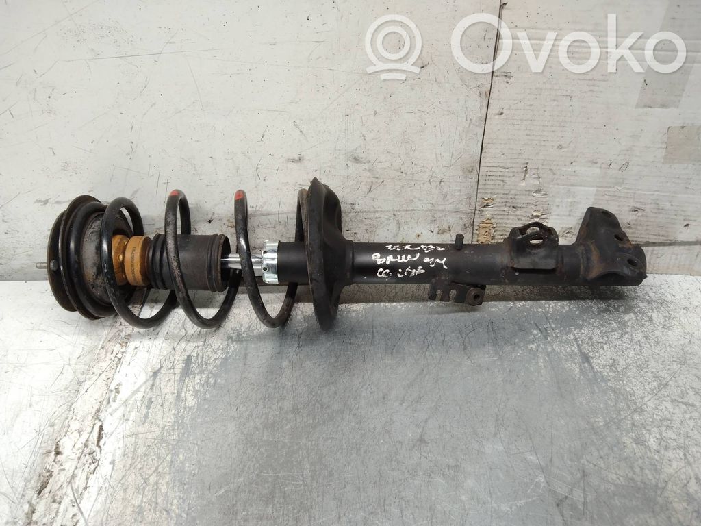 Front shock absorber with coil spring