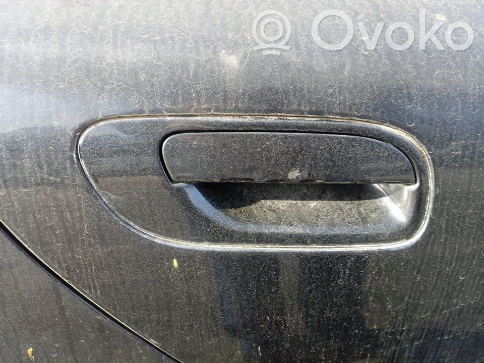 Manecilla externa puerta trasera