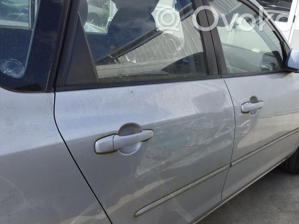 Mazda 3 I Zamek drzwi tylnych 